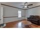 Bright living room with hardwood floors, window, and comfortable seating area at 2856 Jamieson Ln, Indianapolis, IN 46268