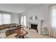 Cozy living room featuring a fireplace, plush seating, and natural light at 2856 Jamieson Ln, Indianapolis, IN 46268