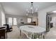 Open living and dining area with fireplace, piano, neutral colors, and lots of space at 2856 Jamieson Ln, Indianapolis, IN 46268