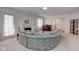 Comfortable living room with a fireplace, piano, and open access to other areas at 2856 Jamieson Ln, Indianapolis, IN 46268