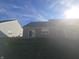 Sunny backyard with grassy area and patio at 3538 Heathcliff Ct, Westfield, IN 46074