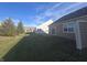 Landscaped backyard with grassy area and patio at 3538 Heathcliff Ct, Westfield, IN 46074