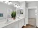 Double vanity bathroom with white cabinets and a view of a bedroom at 3538 Heathcliff Ct, Westfield, IN 46074