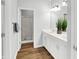 Bathroom with double vanity, white cabinets, and a shower at 3538 Heathcliff Ct, Westfield, IN 46074