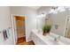 Bathroom featuring a double vanity, framed mirrors, and a glass-enclosed shower at 3538 Heathcliff Ct, Westfield, IN 46074