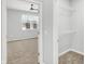 Bedroom with ceiling fan, carpet, and walk-in closet at 3538 Heathcliff Ct, Westfield, IN 46074