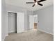 Bedroom with ceiling fan, carpet, and a large closet at 3538 Heathcliff Ct, Westfield, IN 46074