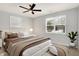 Comfortable bedroom with ceiling fan, window, and plush carpeting at 3538 Heathcliff Ct, Westfield, IN 46074