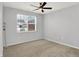 Bright bedroom with large window, ceiling fan, and carpet at 3538 Heathcliff Ct, Westfield, IN 46074