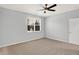 Spacious bedroom with ceiling fan, large window, and neutral decor at 3538 Heathcliff Ct, Westfield, IN 46074