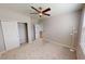 Neutral bedroom with closet and ceiling fan offers a serene retreat at 3538 Heathcliff Ct, Westfield, IN 46074