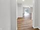 View from entryway to living room and kitchen with wood floors at 3538 Heathcliff Ct, Westfield, IN 46074