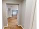 Inviting hallway with beautiful wood flooring leads to an open-concept living space at 3538 Heathcliff Ct, Westfield, IN 46074