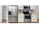 Stainless steel appliances and white cabinetry in this kitchen at 3538 Heathcliff Ct, Westfield, IN 46074
