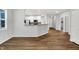 Open concept kitchen with hardwood floors and breakfast bar at 3538 Heathcliff Ct, Westfield, IN 46074