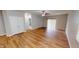 Spacious living room featuring hardwood floors, a ceiling fan and access to an outdoor patio at 3538 Heathcliff Ct, Westfield, IN 46074