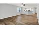 Living room with wood flooring, neutral walls, and access to kitchen and patio at 3538 Heathcliff Ct, Westfield, IN 46074