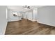 Spacious living room with wood floors, ceiling fan and access to kitchen at 3538 Heathcliff Ct, Westfield, IN 46074