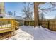 Backyard with snow, wooden fence, and large tree at 5009 E Michigan E St, Indianapolis, IN 46201