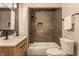 Updated bathroom with gray tile shower/tub combo at 5009 E Michigan E St, Indianapolis, IN 46201
