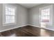 Empty bedroom with hardwood floors and two windows at 5009 E Michigan E St, Indianapolis, IN 46201