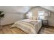 Spacious bedroom with light and airy feel, featuring a comfortable bed and stylish decor at 5009 E Michigan E St, Indianapolis, IN 46201