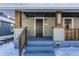 Inviting front porch with wooden posts and railings at 5009 E Michigan E St, Indianapolis, IN 46201