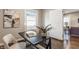 Home office with desk, chair, and view into living room at 5009 E Michigan E St, Indianapolis, IN 46201