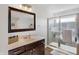 Bathroom featuring a glass-door shower, vanity with sink, and contemporary fixtures at 6431 W Clearview Dr, McCordsville, IN 46055