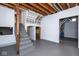 Partially finished basement with stairs, a painted floor, and exposed ceiling with ductwork at 7027 Creekside Ln, Indianapolis, IN 46220