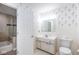 Bright, traditional-style bathroom with floral wallpaper and a tiled shower/tub combination at 7027 Creekside Ln, Indianapolis, IN 46220