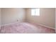 This bedroom has light-colored walls, a window letting in natural light, and carpeted floors at 7027 Creekside Ln, Indianapolis, IN 46220