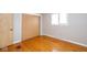 Bedroom featuring hardwood floors, a large closet, and a window for plenty of light at 7027 Creekside Ln, Indianapolis, IN 46220
