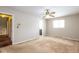 Spacious bedroom featuring neutral walls, plush carpeting, and a ceiling fan at 7027 Creekside Ln, Indianapolis, IN 46220
