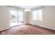 Bright dining room features a sliding glass door and a chandelier at 7027 Creekside Ln, Indianapolis, IN 46220