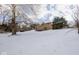 The backyard offers a deck and mature trees adding to this home's appeal at 7027 Creekside Ln, Indianapolis, IN 46220