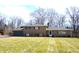 Charming brick home featuring a well-maintained lawn and mature trees in a desirable neighborhood at 7027 Creekside Ln, Indianapolis, IN 46220
