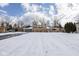 This home is a single-Gathering home with a large front yard and driveway at 7027 Creekside Ln, Indianapolis, IN 46220