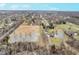 Expansive aerial view of the property and neighborhood, showcasing the land with ponds and swimming pool at 3592 W Smokey Row Rd, Bargersville, IN 46106