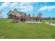 Sprawling backyard featuring a swimming pool, patio, screened in porch, and scenic pond at 3592 W Smokey Row Rd, Bargersville, IN 46106