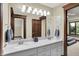Bright bathroom features a dual sink vanity, modern lighting, and neutral color scheme at 3592 W Smokey Row Rd, Bargersville, IN 46106
