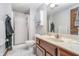 Well-lit bathroom with a shower, vanity, marble flooring and ample cabinet space at 3592 W Smokey Row Rd, Bargersville, IN 46106