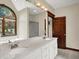 Bright bathroom with a dual sink vanity, a modern window, and a large framed mirror at 3592 W Smokey Row Rd, Bargersville, IN 46106