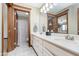 Bathroom with double sinks, white cabinets, marble floor, framed mirror, and access to a shower and toilet at 3592 W Smokey Row Rd, Bargersville, IN 46106