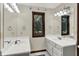 Bathroom boasts double sinks, and a large window with natural light that brighten the space at 3592 W Smokey Row Rd, Bargersville, IN 46106