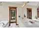 Well-lit bathroom featuring a double sink vanity, soaking tub, and classic tile work at 3592 W Smokey Row Rd, Bargersville, IN 46106