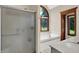 Contemporary bathroom with a frameless shower, soaking tub, arched window, and tile flooring at 3592 W Smokey Row Rd, Bargersville, IN 46106