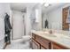 The bathroom has marble floors, a glass enclosed shower and a wood vanity with countertop at 3592 W Smokey Row Rd, Bargersville, IN 46106