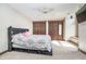 Cozy bedroom offers a comfortable bed, ceiling fan, and natural light from a window at 3592 W Smokey Row Rd, Bargersville, IN 46106