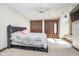 Bedroom featuring a ceiling fan, carpet, two closets, a large bed, and a tv on the wall at 3592 W Smokey Row Rd, Bargersville, IN 46106